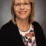 A portrait of associate clinical professor Millicent Malcolm.