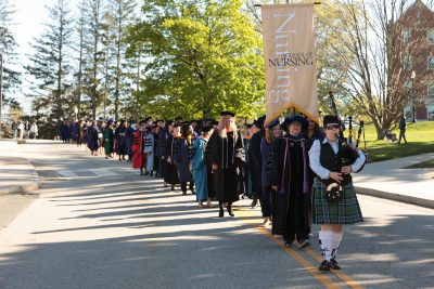 Nursing procession at commencement down road.