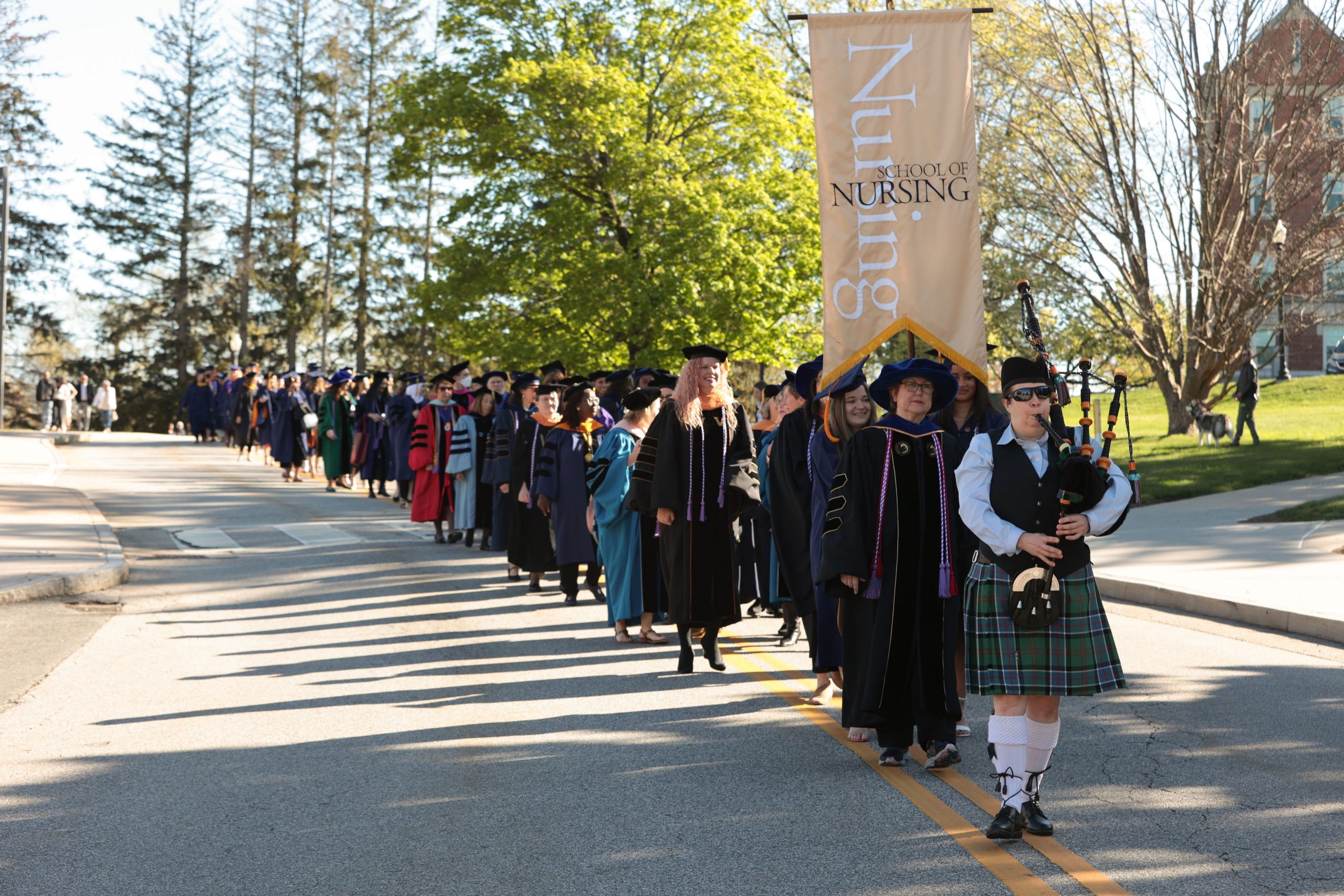 Nursing procession at commencement down road. 