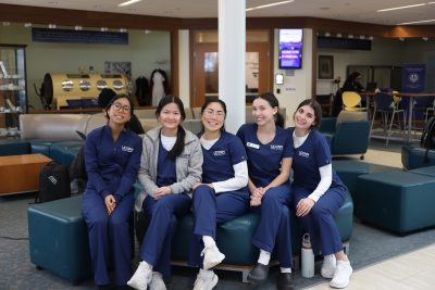 UConn Nursing students pose in widmer wing. 